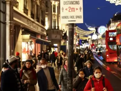 people-walk-along-regent-street-amid-the-coronavirus-disease-covid-19-outbreak-in-london