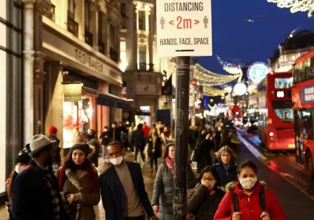 people-walk-along-regent-street-amid-the-coronavirus-disease-covid-19-outbreak-in-london