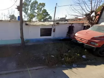 El cuerpo fue hallado envuelto en una frazada, entre dos camiones estacionados.